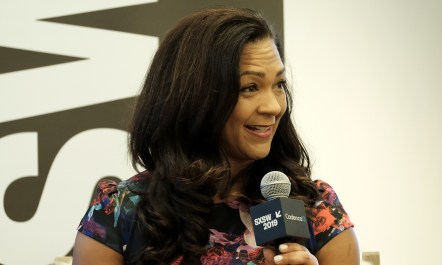 Aimee Allison speaking at an event.