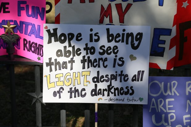 a square sign reads Hope is being able to see that there is light despite all of the darkness.