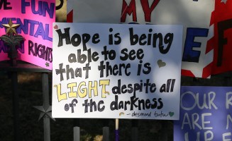 a square sign reads Hope is being able to see that there is light despite all of the darkness.