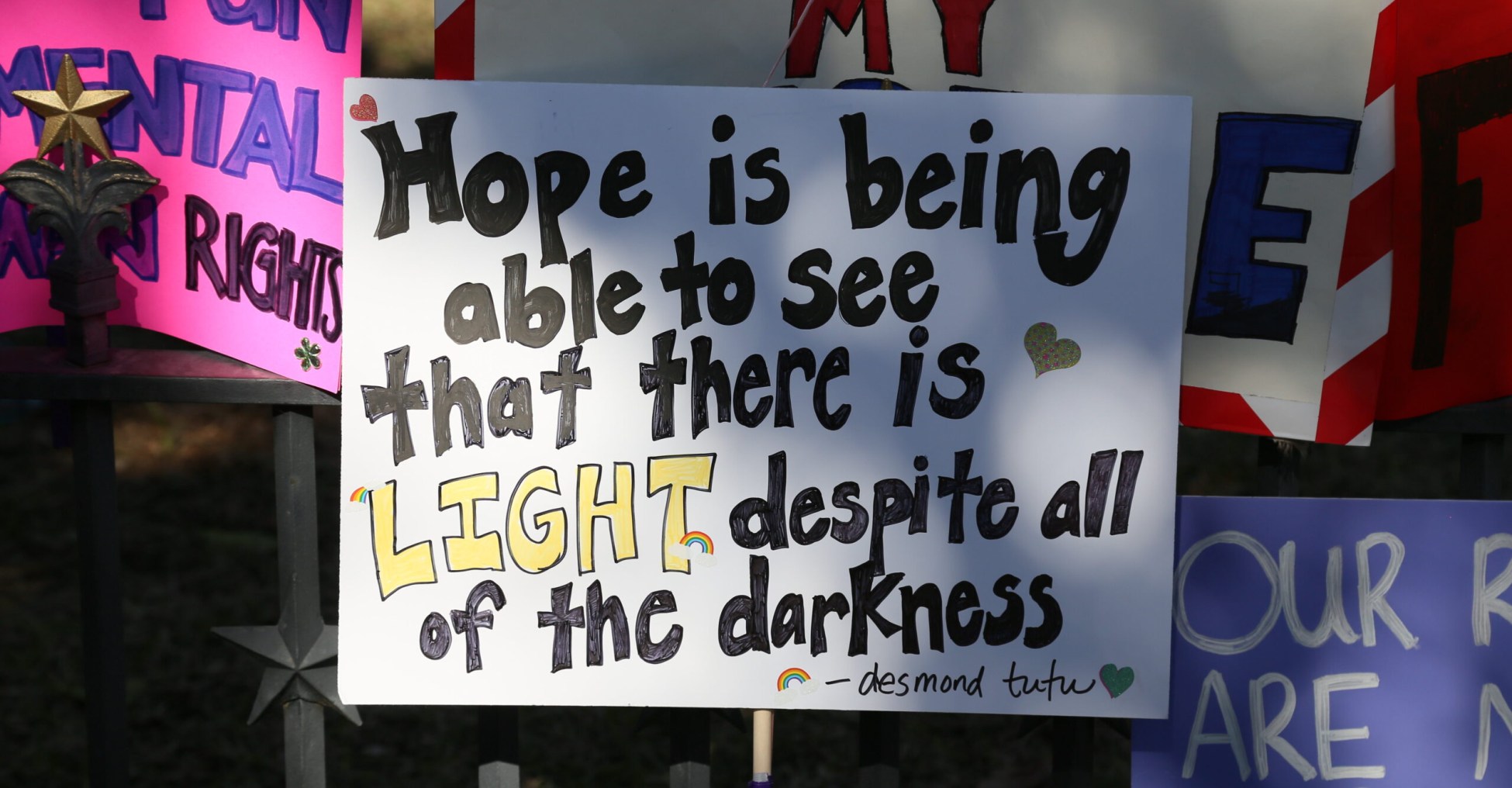 a square sign reads Hope is being able to see that there is light despite all of the darkness.