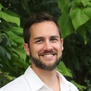 Kevin Young, a white man with facial hair, smiles