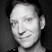 Lindsey Danis is a white queer person with a short haircut