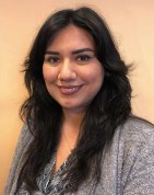 Vanessa Godinez is a woman with long hair and a gray blazer on